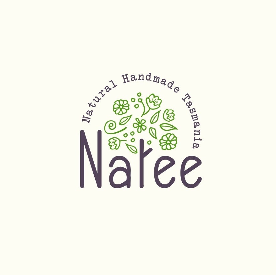 round  logo  with the letter “t” in “Natee” illustrated as a tree trunk with green leaves and flowers floating above it