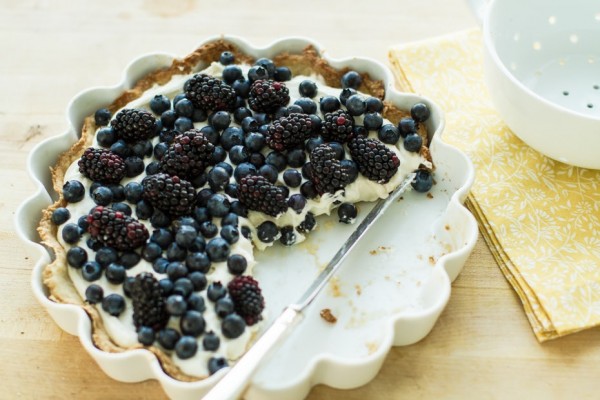 Blueberry and blackberry pie with a piece missing